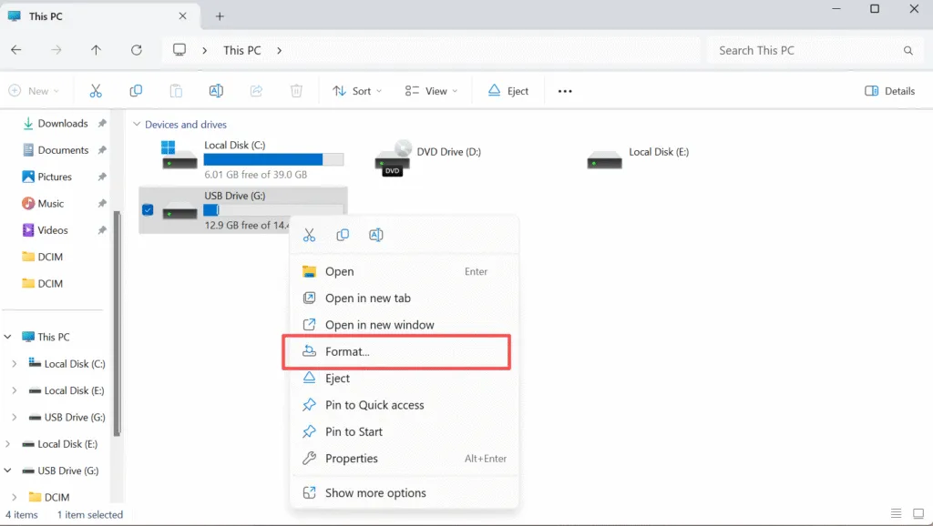 User connecting a USB flash drive before choosing how to format a USB drive to FAT32.